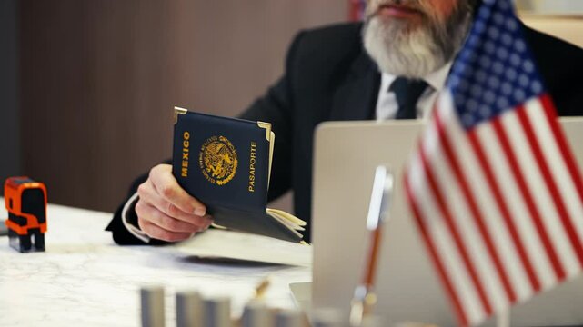 U.S. embassy worker places denied stamp in Mexican womans passport, visa refusal