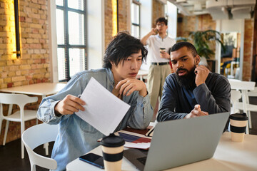 Engaging collaboration among coworkers at a modern office workspace in a vibrant environment