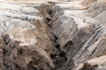 Ural Mars. An extraordinarily beautiful summer landscape with red lakes, colorful slopes and forest. A picturesque mountain range. Natural landscape, impressive sky. Nature of the Urals.