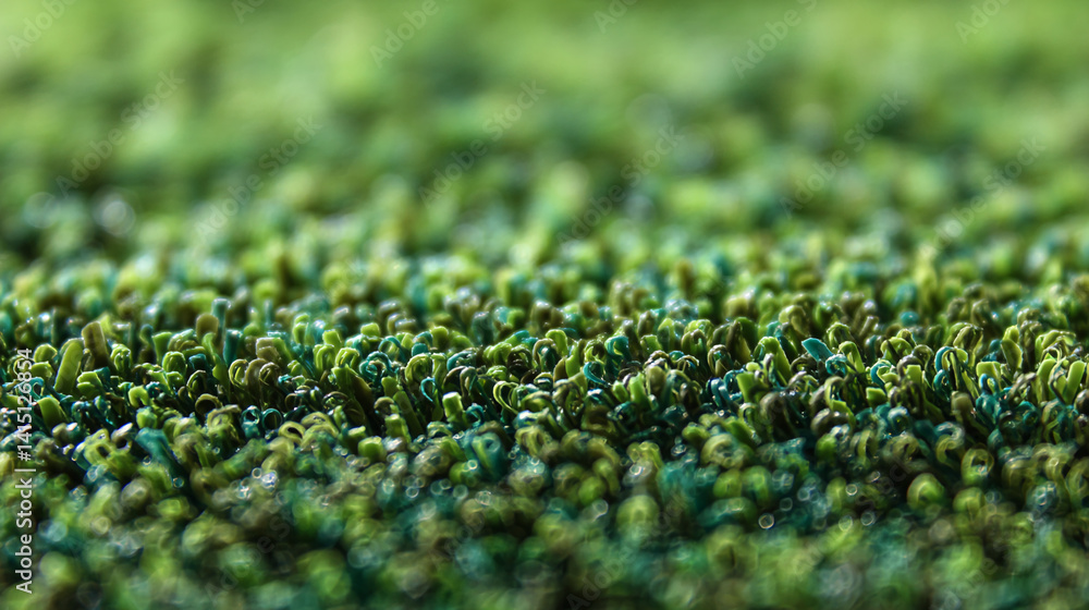 Poster Close-up of green and teal textile texture, showing dense, short fibers creating a plush surface, suggesting softness and nature, ideal for background or texture use
