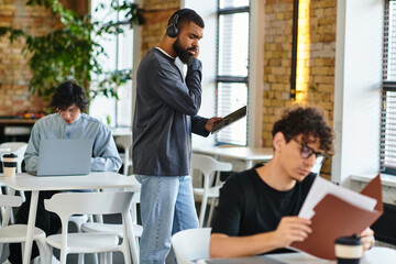 Engaged professionals collaborating in a modern co working space with a vibrant atmosphere
