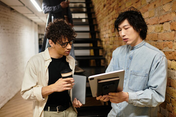 Collaborative discussion between colleagues in a modern office environment during work hours