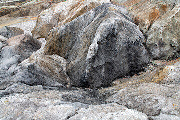 Ural Mars. An extraordinarily beautiful summer landscape with red lakes, colorful slopes and forest. A picturesque mountain range. Natural landscape, impressive sky. Nature of the Urals.