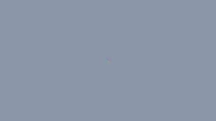 Uniform, light gray background with faint, colorful,  chromatic aberration
