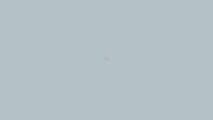 Simple, muted, light gray background with faint, colorful,  speck