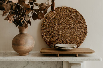 Rustic Table Setting with Wooden Vase and Ceramic Plates on Marble Mantel