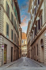 Medieval Florence with historic buildings, cobblestone streets, under clear blue skies