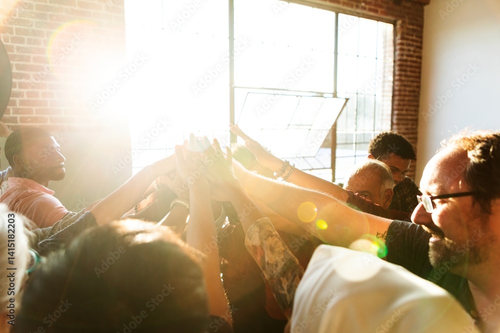 Poster diverse group of people joining hands upwards in sunlight, symbolizing teamwork and unity. hands rai