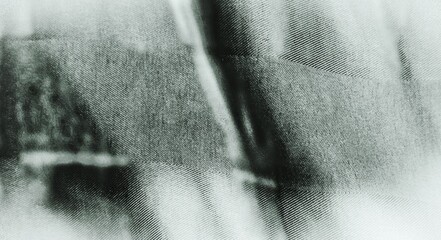 Texture background of woven lines in alternating dark and light grey tones, feels like folded satin or denim with light hitting it. Deep shadows add depth. Classic and modern feel for design, fashion