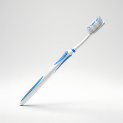 Angled White Toothbrush with Blue Grip and Soft Bristles on Clean Background