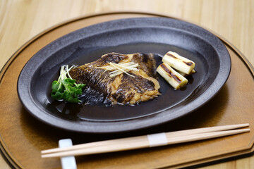 Boiled flatfish in a broth of sweetened soy sauce-based dashi, Japanese cuisine
