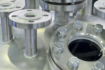 Various parts of high pressure equipment - stainless steel pipes, flanges and plugs