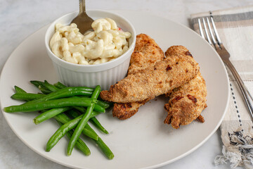chicken  tenders with green beans and macaroni salad