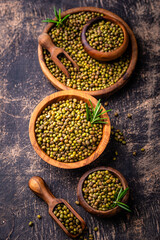 Raw uncooked mung beans on black background