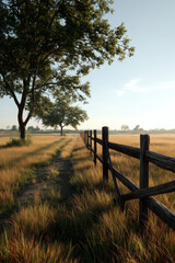 Obraz premium Golden field with a wooden fence under a sunny sky, nature's beauty. Tranquil countryside vista.