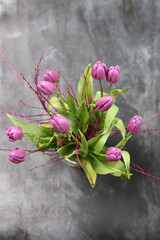 Bouquet of beautiful tulips on grey background, closeup