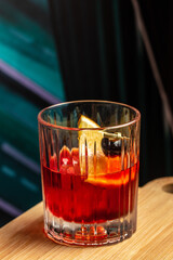 negroni cocktail, men's alcoholic drink on a dark background. top view. copy space for text