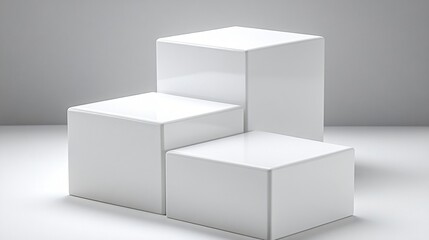 Set of white cubic podiums with modern clean design for product presentation or exhibition mockups.