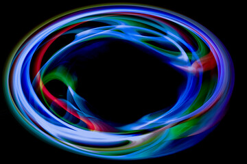 黒バックの中のカラフルな光の渦
