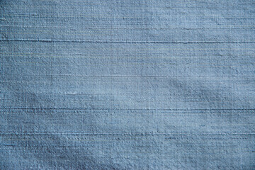 Blue shantung silk  fabric texture detail closeup as textile background