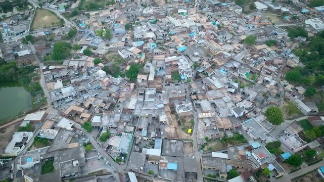 Drone Footage of Overpopulated Indian(Punjab) Village with Packed Houses and Crop Fields
