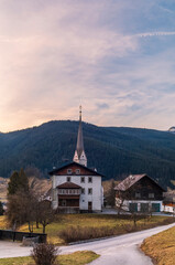 Fototapeta premium The catholic church in Gosau in Austria early in the morning