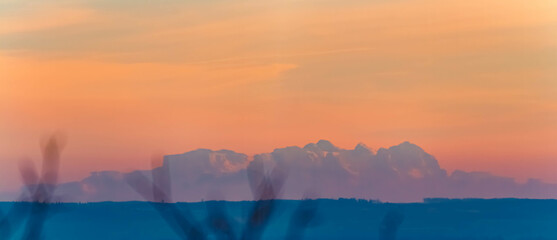 Sunset with the 150 km distant alps seen from Mount Bogenberg, Bogen, Danube, Straubing-Bogen, Bavaria, Germany
