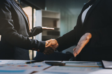 Business success. Business people shaking hands agreement confirmed in the investment business.