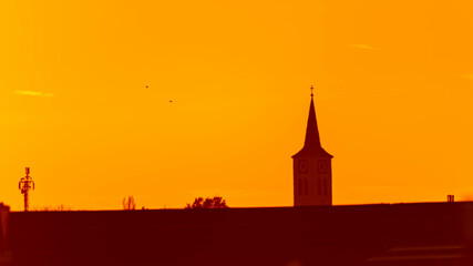 Winter view near sunset or sundowner with a church silhouette near Haunersdorf, Otzing, Deggendorf, Bavaria, Germany