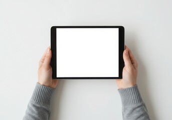 Hands holding a black tablet with a blank white screen display isoleted on white background