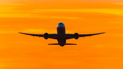 Summer sunset or sundowner view with a jet airplane at Munich airport, MUC, Freising, Bavaria, Germany