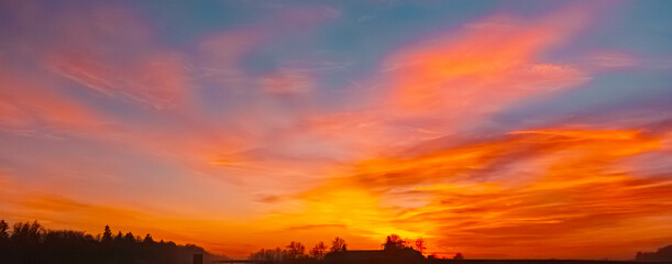 Sunset with dramatic clouds near Plattling, Isar, Bavaria, Germany