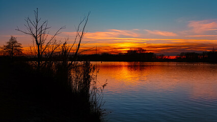 Summer sunset or sundowner view with reflections near Plattling, Isar, Deggendorf, Bavaria, Germany