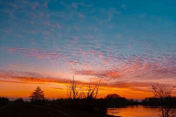 Sunset with reflections near Plattling, Isar, Bavaria, Germany