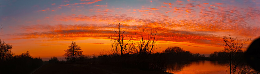 Sunset with reflections near Plattling, Isar, Bavaria, Germany