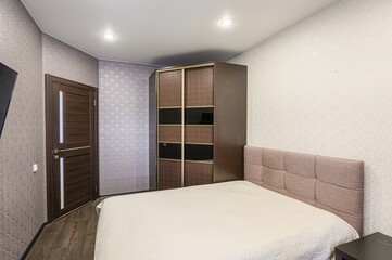 interior room apartment bedroom with bed, cozy place to sleep and relax