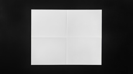 A white sheet of paper is elegantly folded.