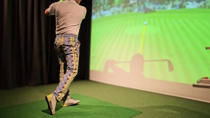 Golf training session in an indoor simulator featuring a player practicing swings