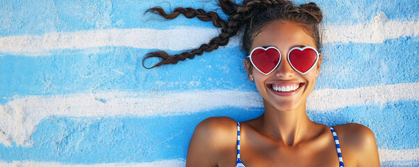 Happy Black Woman Wearing Heart Sunglasses Relaxing at Beach on a Sunny Day.