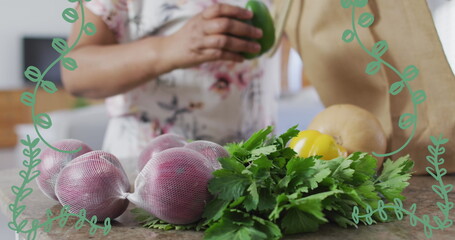 Image of plant icons over caucasian woman with vegetables