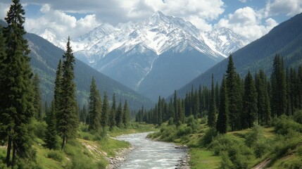 Picturesque mountain valley with a river flowing through a dense forest. Snow-capped peaks in the background