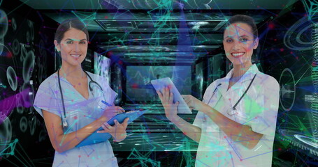 Image of caucasian female doctors over data processing