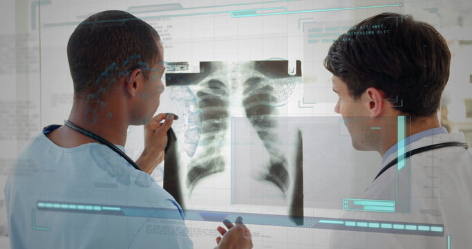 Image of diverse doctors talking over data processing