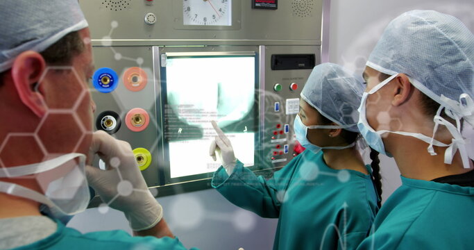 Image of diverse doctors with xray over data processing