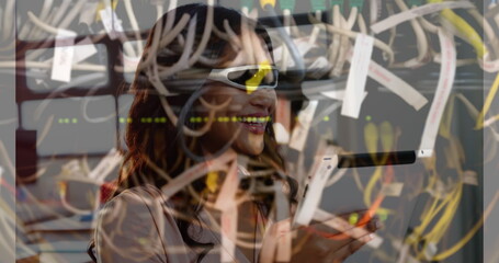 Image of women using vr headset over server room