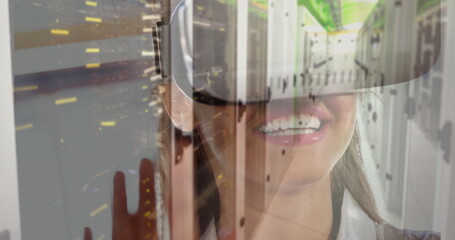 Image of women using vr headset over server room