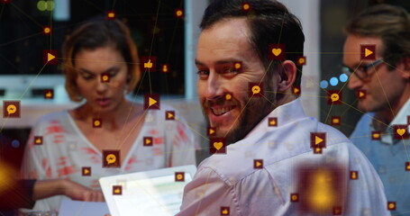 Fototapeta premium Image of network of connections with icons over business people