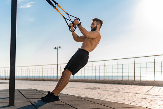 attractive hansome man shirtless with athletic strong body on morning fitness workout exercise