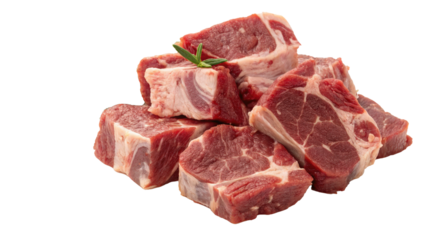 Chunks of raw goat meat are neatly cut for stew, showcasing rich red color and marbled texture. sprig of rosemary adds touch of freshness to arrangement