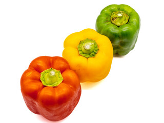 three colored bell peppers isolated on white background